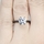 Enya's Black Plated Round Cut Engagement Ring