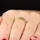 Kee's Goldtone Eternity Ring - Green CZ